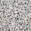 72 grams of 7mm White with Black Lettering Plastic Alphabet Disk Beads